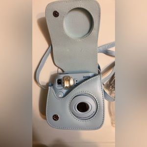 Light blue Instax mini Polaroid